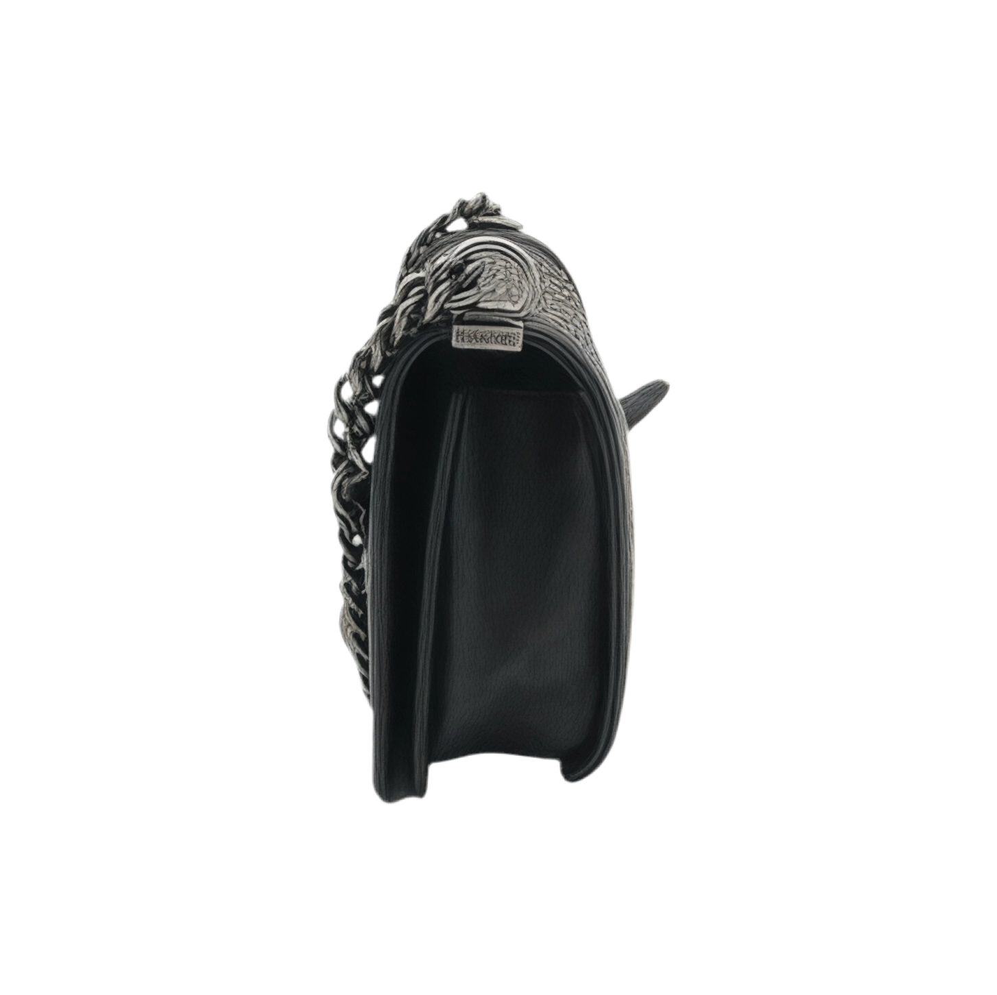 Side view of black medium Chanel Boy bag with chain detail on a white background