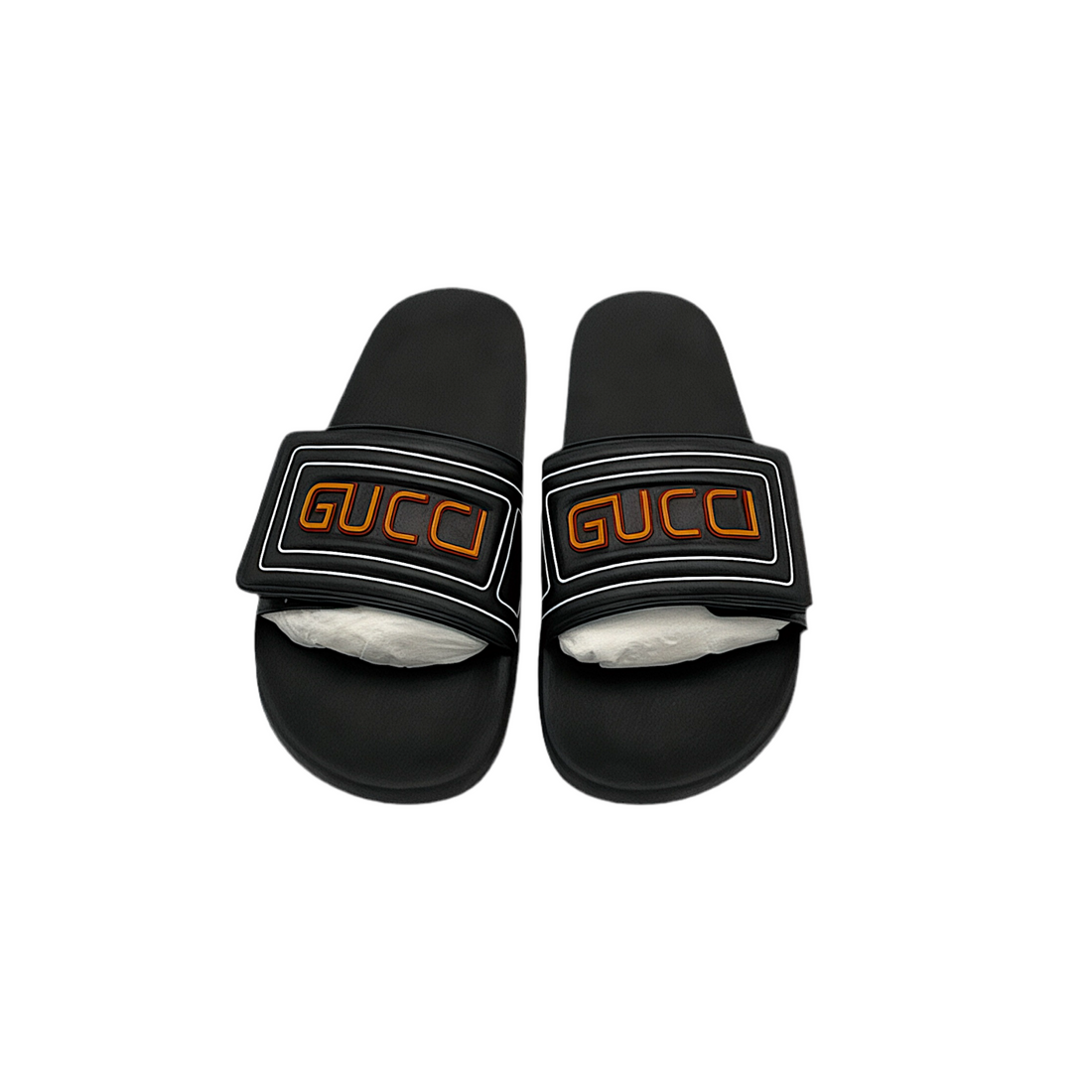 Front view of men's black Gucci slides with orange logo on a white background