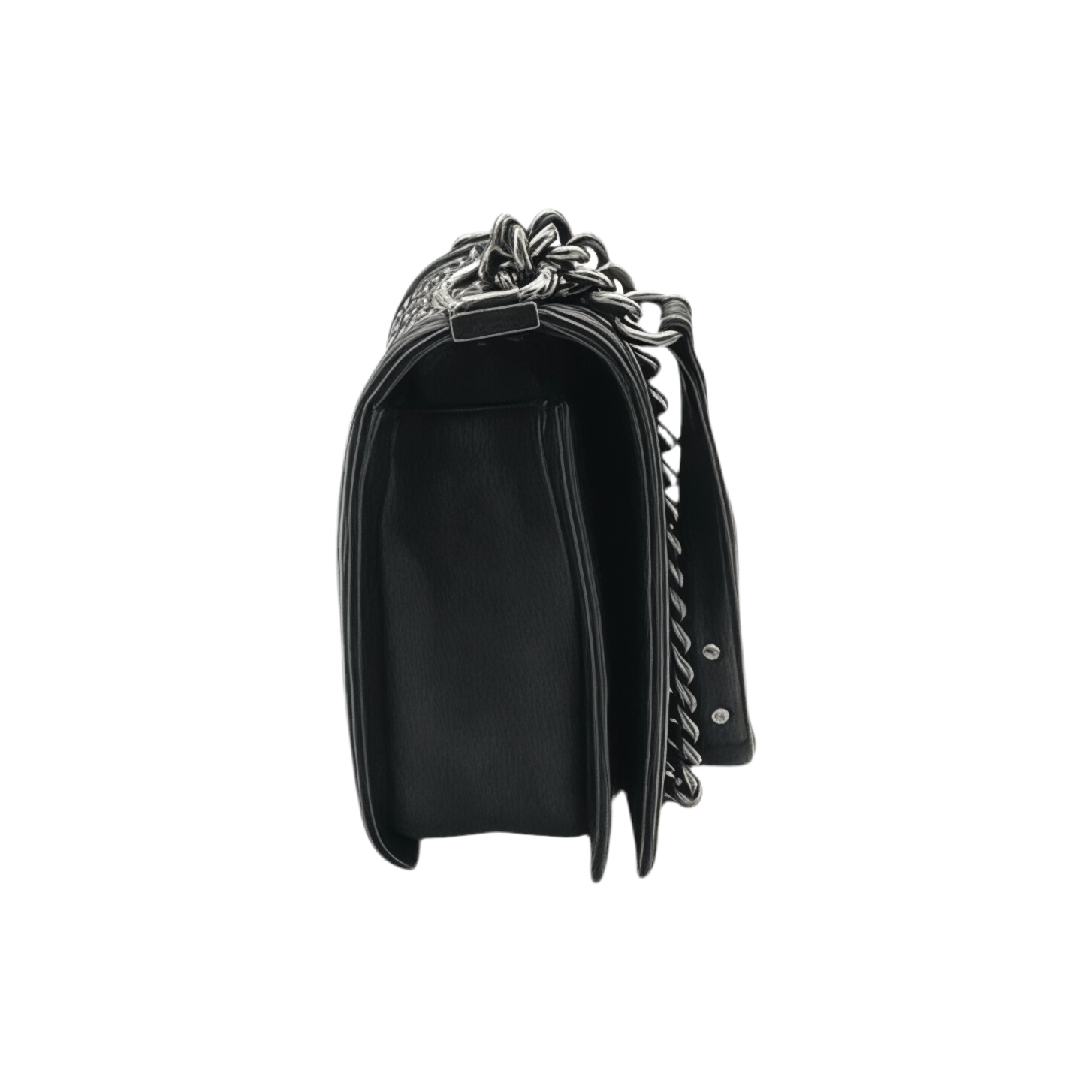 Side view of black  medium Chanel Boy bag with silver chain strap on a white background