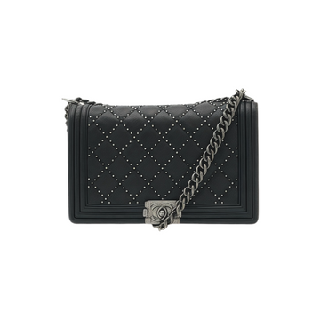 Front view of black quilted medium Chanel Boy Bag with chain strap on a white background