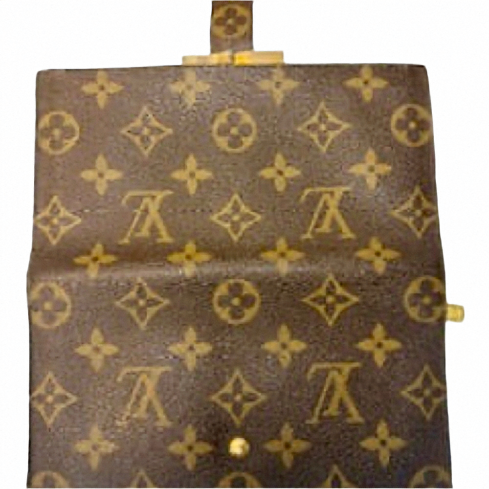 Cartera larga plegable con monograma y cierre de beso de Louis Vuitton